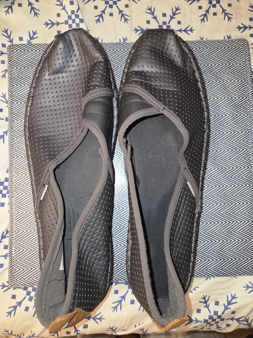 TOMS Black Laser-Cut Perforated Women's Perforated Slip-On Flats in Black